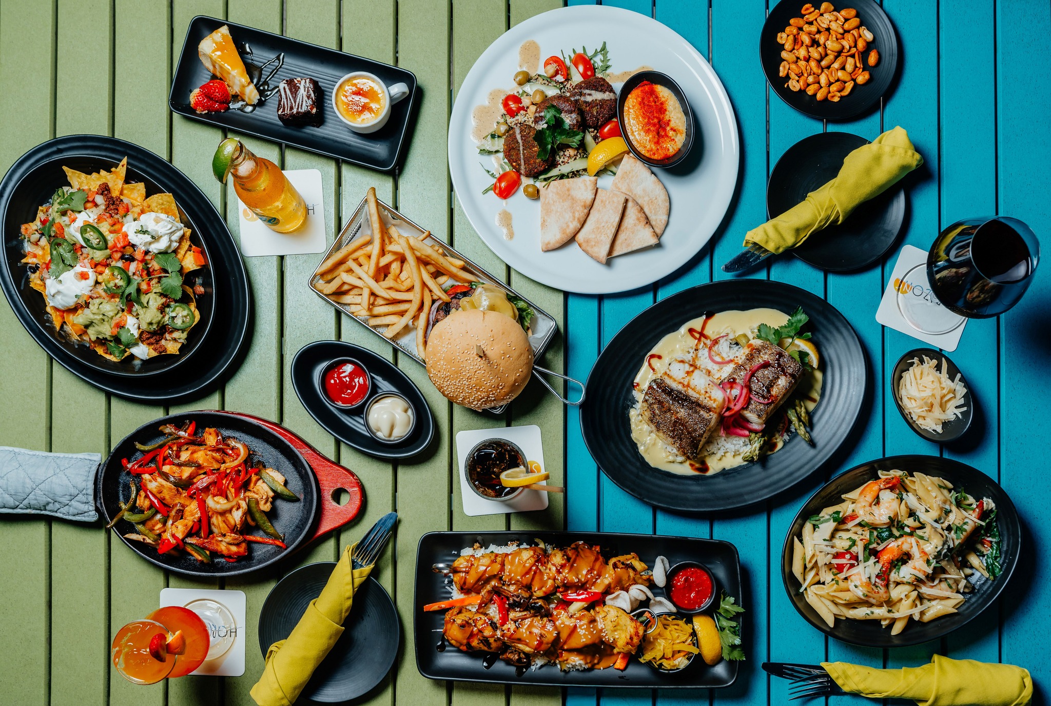 Overhead view of a colorful Caribbean food spread on the table